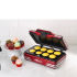 Enjoy delicious cupcakes quickly and easily with the SMART Retro Mini Cupcake Maker. Boasting a robust design, the cupcake maker has a non-stick finish so you can effortlessly remove your cupcakes once they're cooked. Simply fill the eight moulds with cake mixture, pull down the lid and wait for the indicator lights to tell you when your treats are ready. The unit is also easy to clean after use. - L.M.  Features:    SMART Retro Mini Cup Cake Maker  Makes 8 mini cupcakes  Non-stick finish for easy removal  Indicator lights  Easy to use and clean  Robust design  Fast cooking