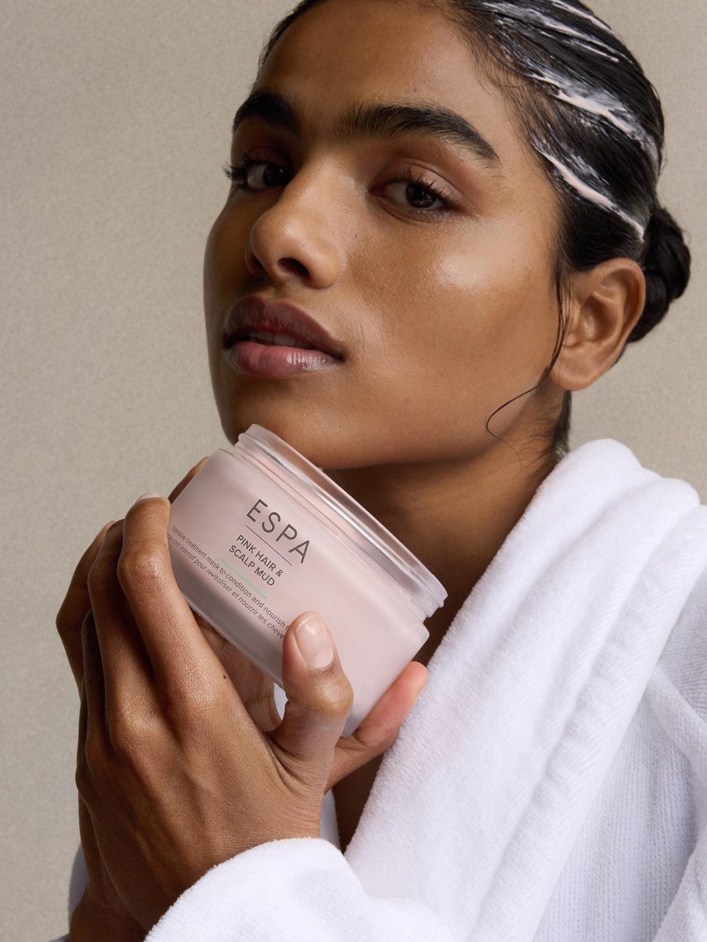 Model with pink hair and scalp mask in her hair