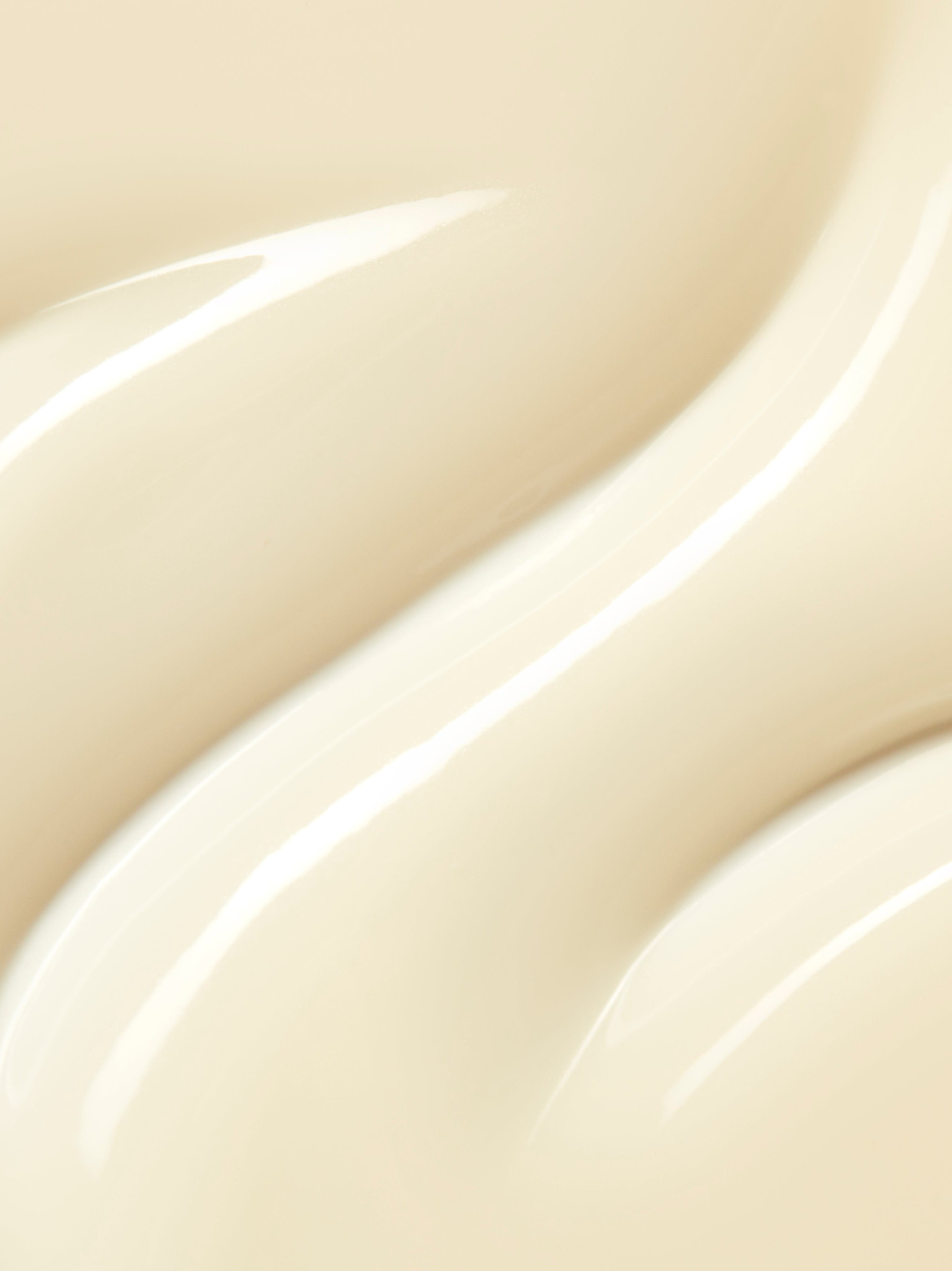 Swatch of texture of a white creamy serum