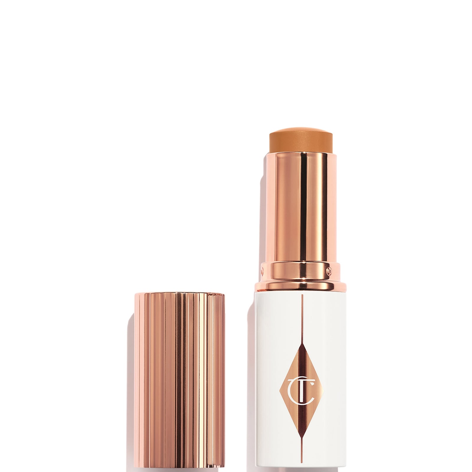 Charlotte Tilbury Unreal Skin Sheer Glow Tint - Hydrating Foundation Stick 12 Tan - Image 3