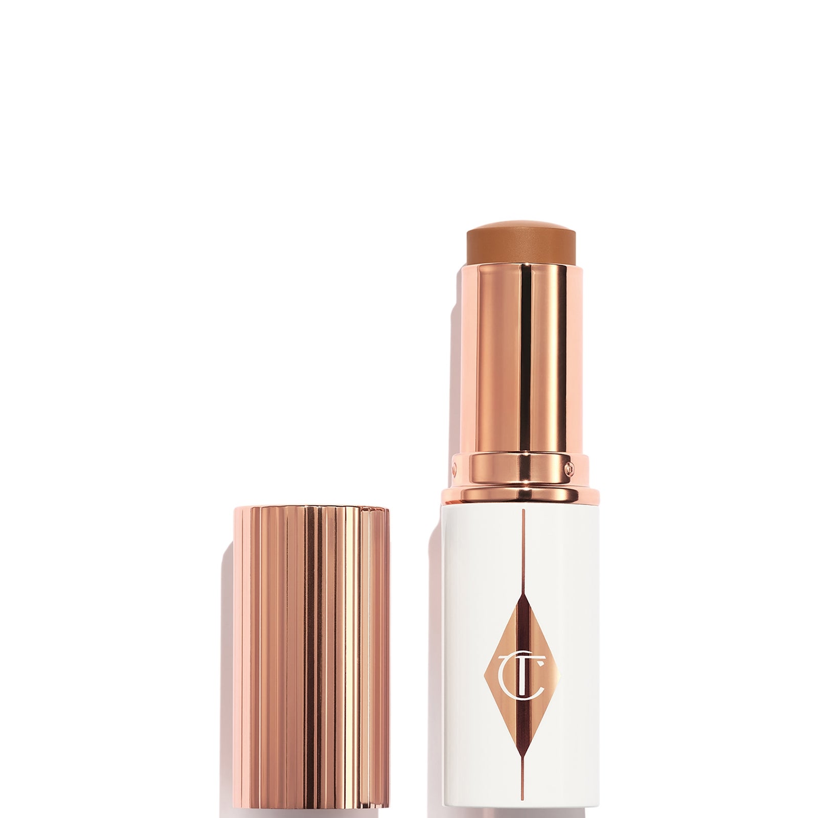 Charlotte Tilbury Unreal Skin Sheer Glow Tint - Hydrating Foundation Stick 12.5 Tan - Image 3
